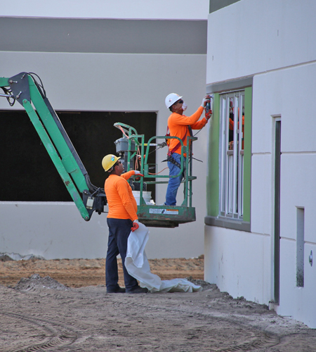 Construction on exterior walls and windows of building in orlando fl