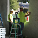 subcontractors adding windows for lighting